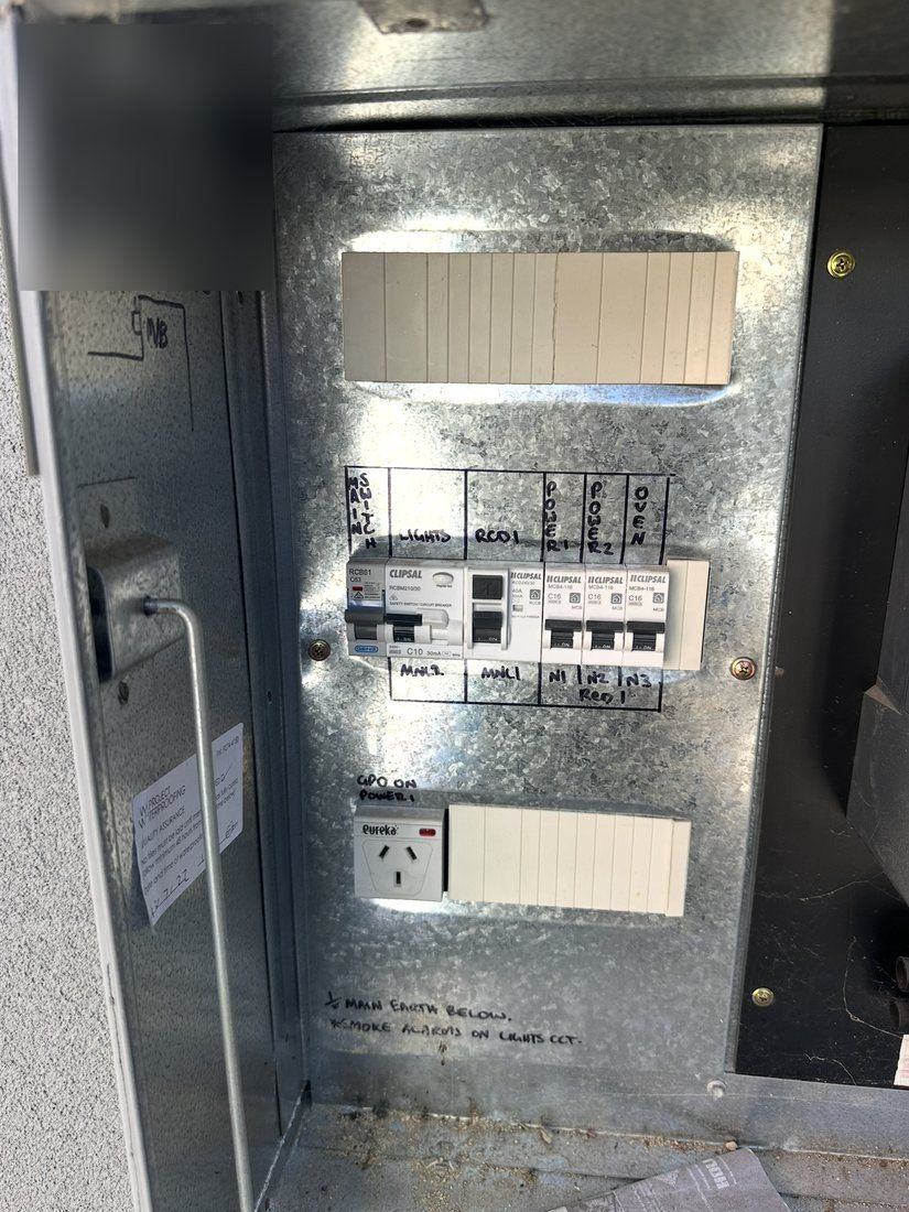 Upgraded switchboard with circuit breakers, RCD protection and spare poles in a galvanised meter box