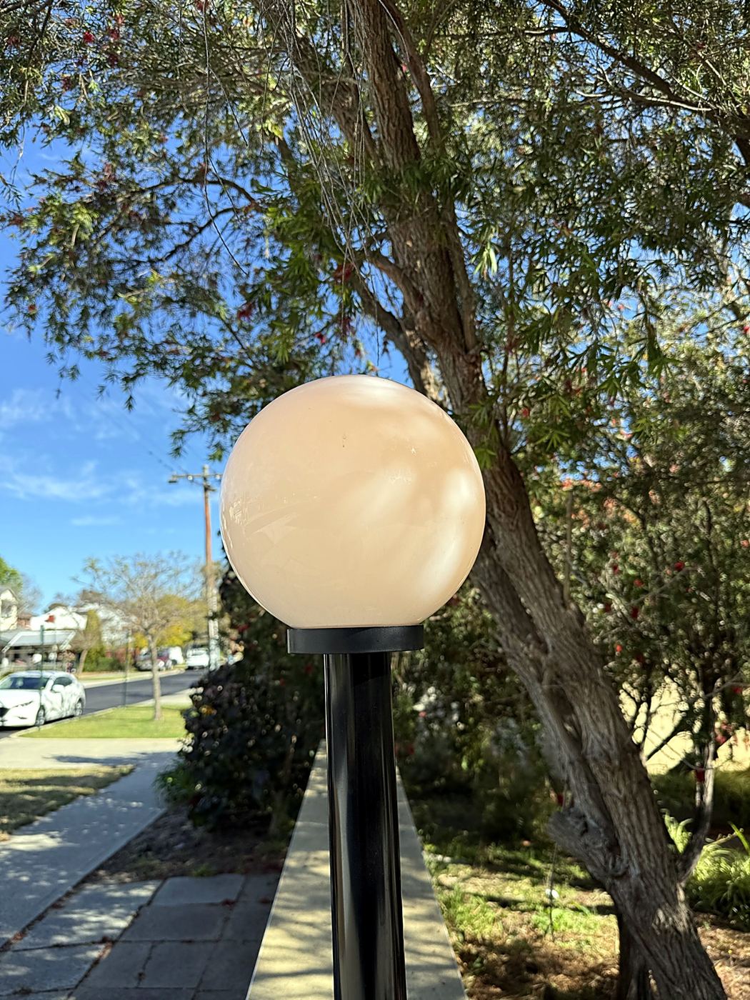 Garden bollard light beside a footpath