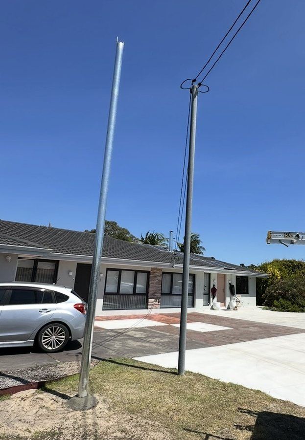 New galvanised consumer pole installed beside the old pole it replaced, Perth