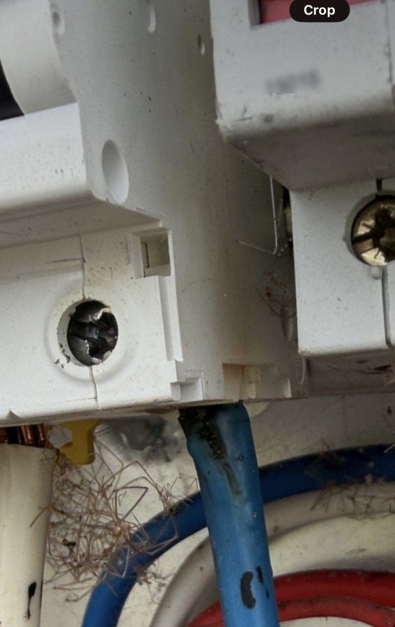 Burn damage and melted insulation inside an aged switchboard